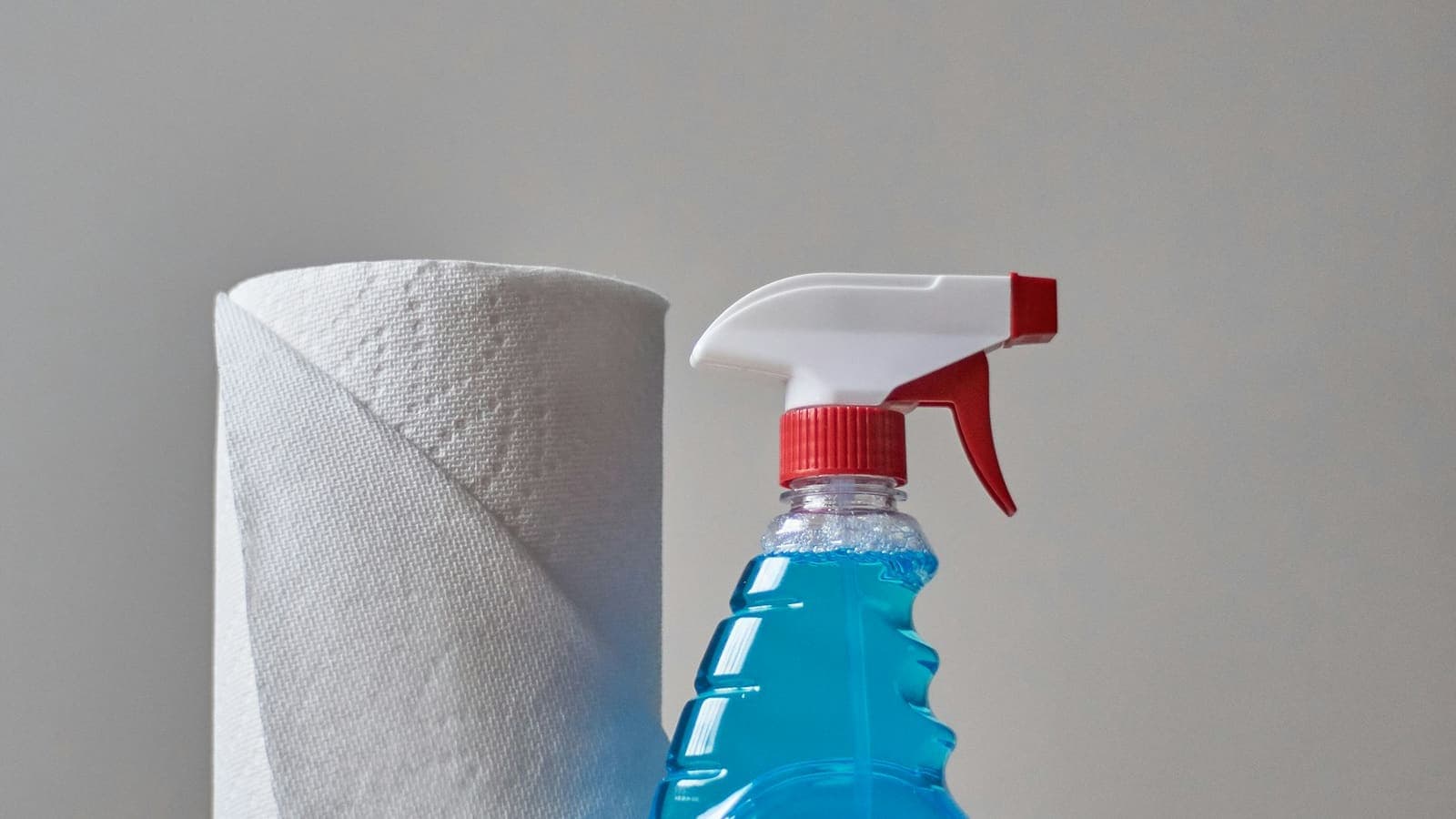 Professional cleaner wiping a kitchen counter on a residential cleaning job