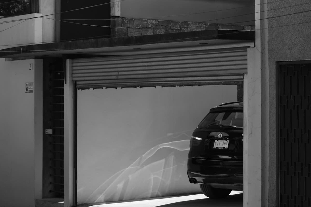 Pressure washer checking Houseler on a phone at a job site